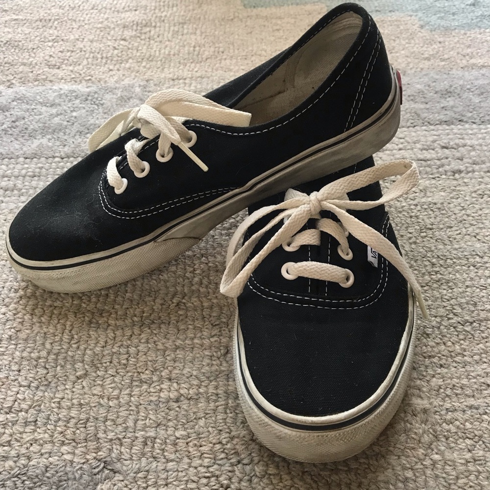 Black low top lace up Vans